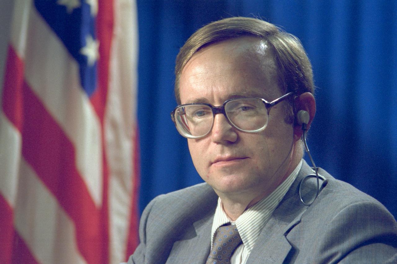 Flight Director Tommy Holloway listens to a question from a news media representative during a STS-5 pre-flight press briefing.