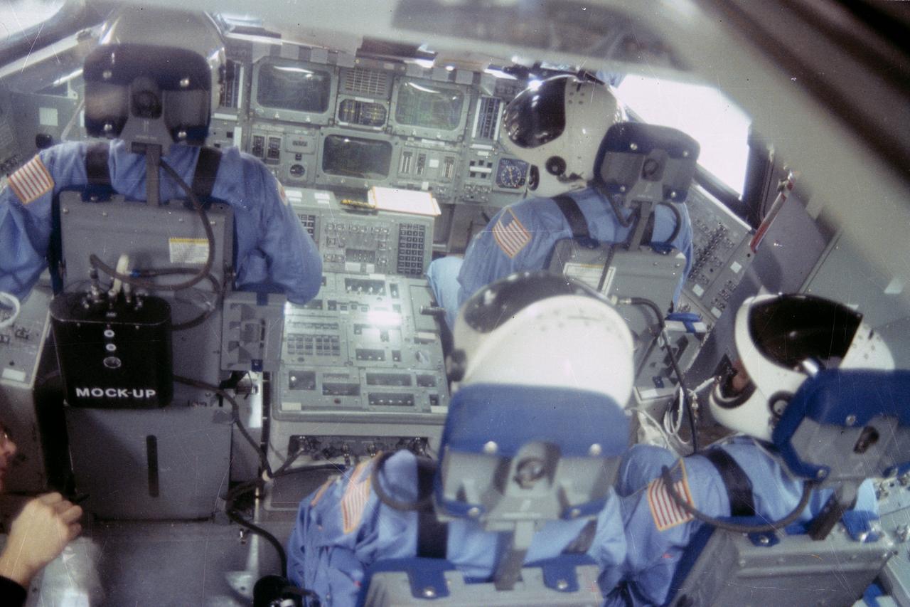 S82-41355 (December 1982) --- The four crew members for NASA?s STS-6 mission go through a training exercise in the full-scale engineering mock-up in the shuttle mock-up and integration laboratory at the Johnson Space Center (JSC). Their seating configuration reflects that of launch and landing phases aboard the space shuttle Challenger. The front stations are occupied by astronauts Paul J. Weitz (left), commander, and Karol J. Bobko, pilot. In the rear seats are astronauts Story Musgrave and Donald H. Peterson, both mission specialists. STS-6 will be the Challenger?s first flight when it takes this crew and a tracking and data relay satellite (TDRS) into Earth orbit the early part of next year. Photo credit: NASA