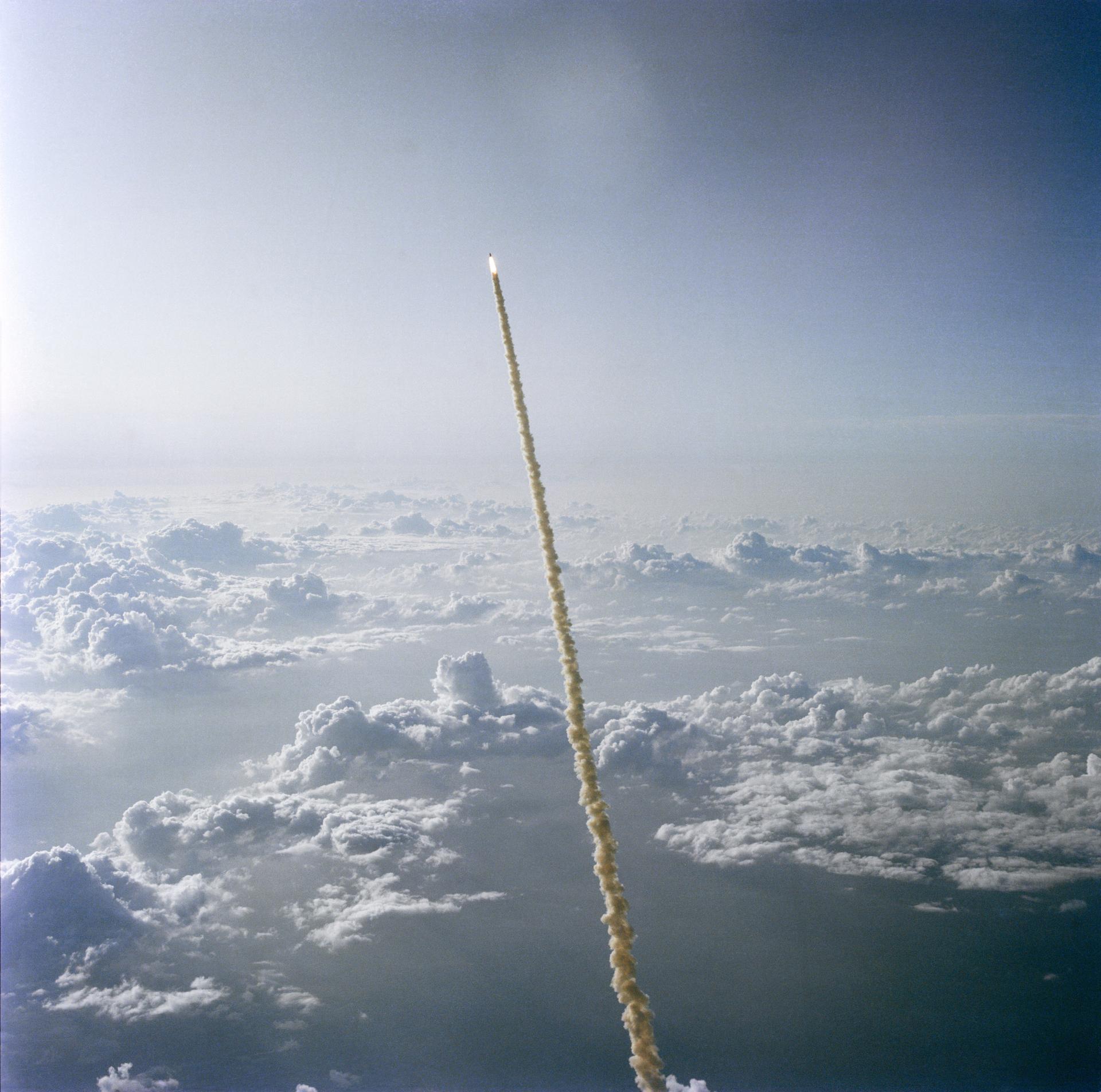 STS-7 launches above the clouds