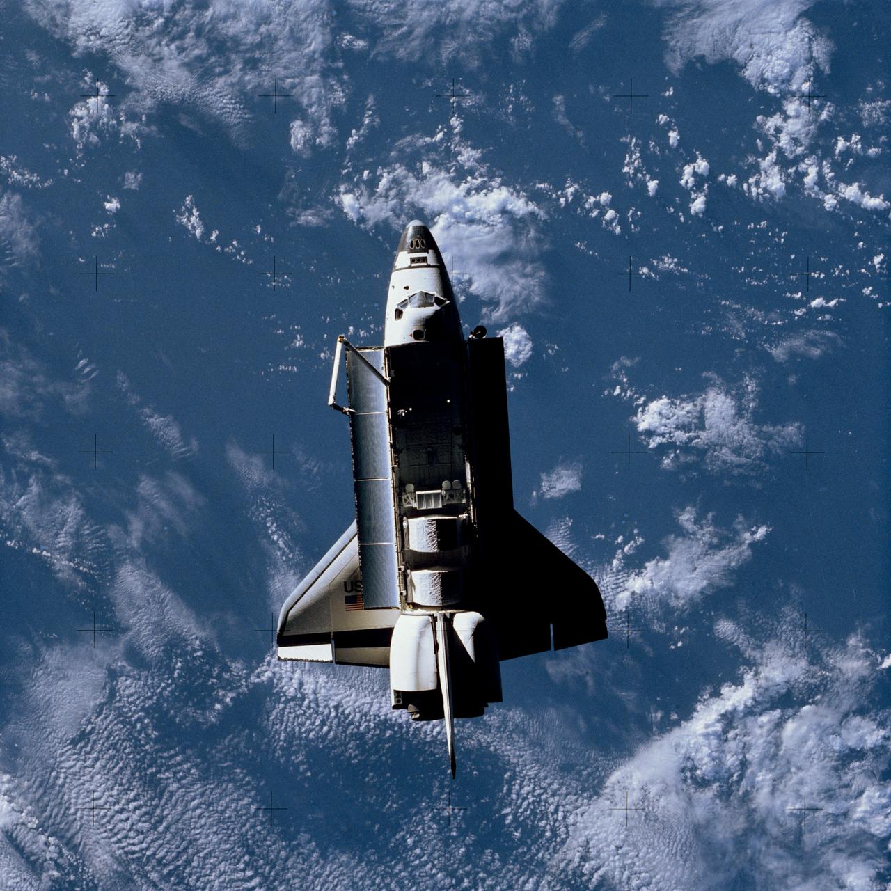 Full views of "Challenger" in Space, taken by the Shuttle Pallet Satellite (SPAS), also views of Cargo Bay and Remote Manipulator System (RMS) extended.      1.  SHUTTLE - RMS (STS-7)      Also available in 4x5 CN