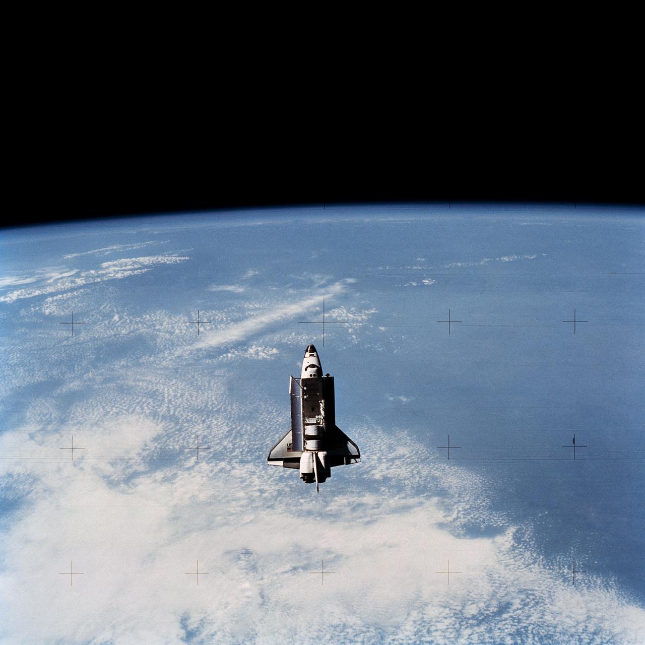 Full views of "Challenger" in Space, taken by the Shuttle Pallet Satellite (SPAS), also views of Cargo Bay and Remote Manipulator System (RMS) extended.      1.  SHUTTLE - RMS (STS-7)      Also available in 4x5 CN