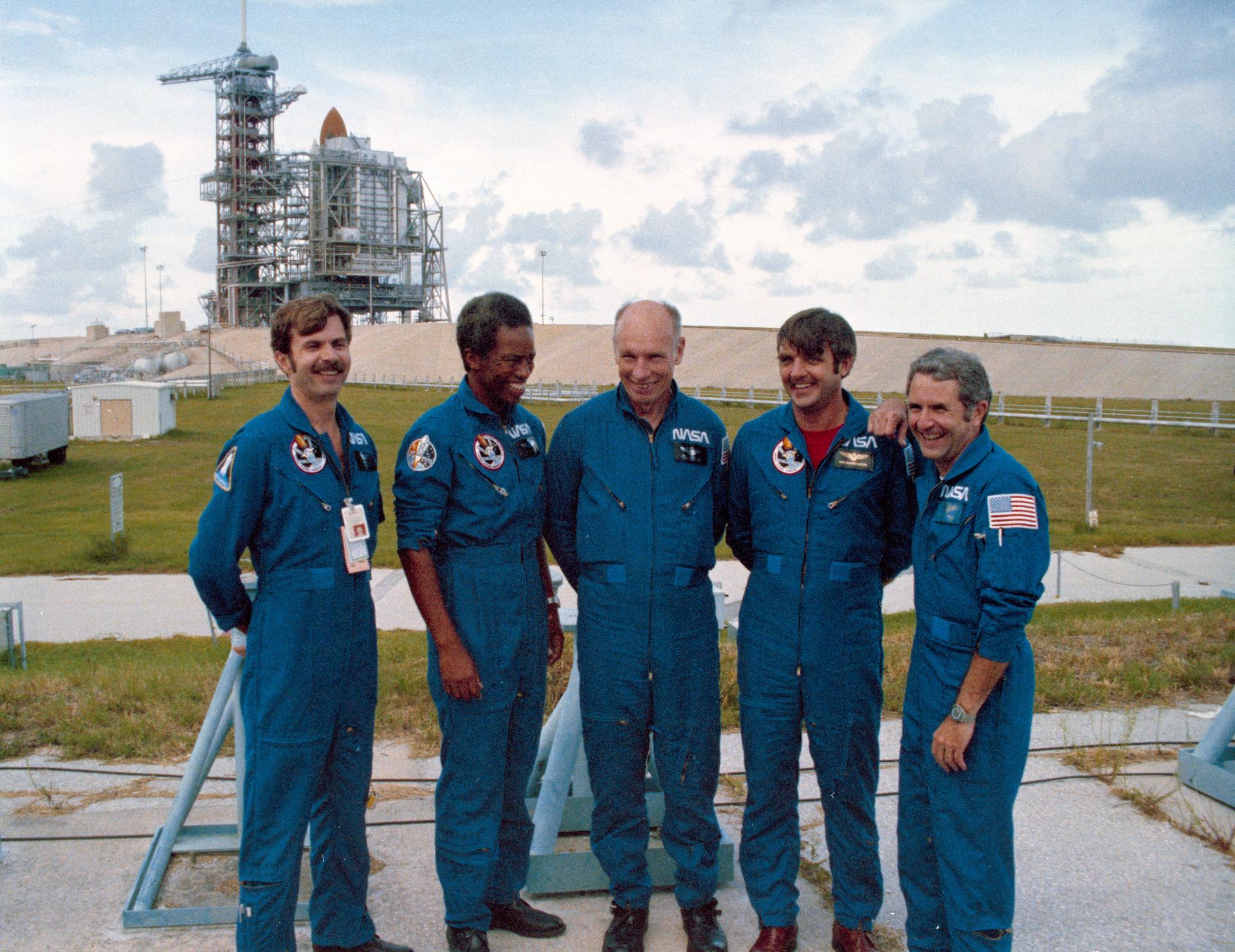 The crew of STS-8 pose for a photo at Pad 39A