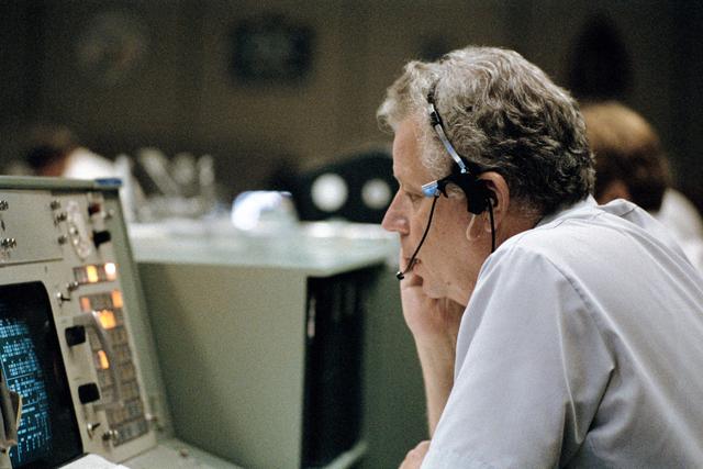 NASA image: Terry White seated at the public affairs console STS-8