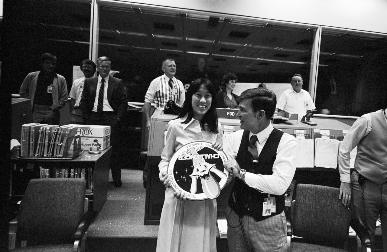 STS-8 MCC Activities, Day 6 CapComs, Astronaut Bill Fisher and Flight Director Harold Draughon.                1.  INFLIGHT - STS-8 (MCC)       2.  FISHER, ANNA - STS-8 (MCC)       3.  FISHER, BILL - STS-8 (MCC)              JSC, HOUSTON, TX              Also available in 35 CN