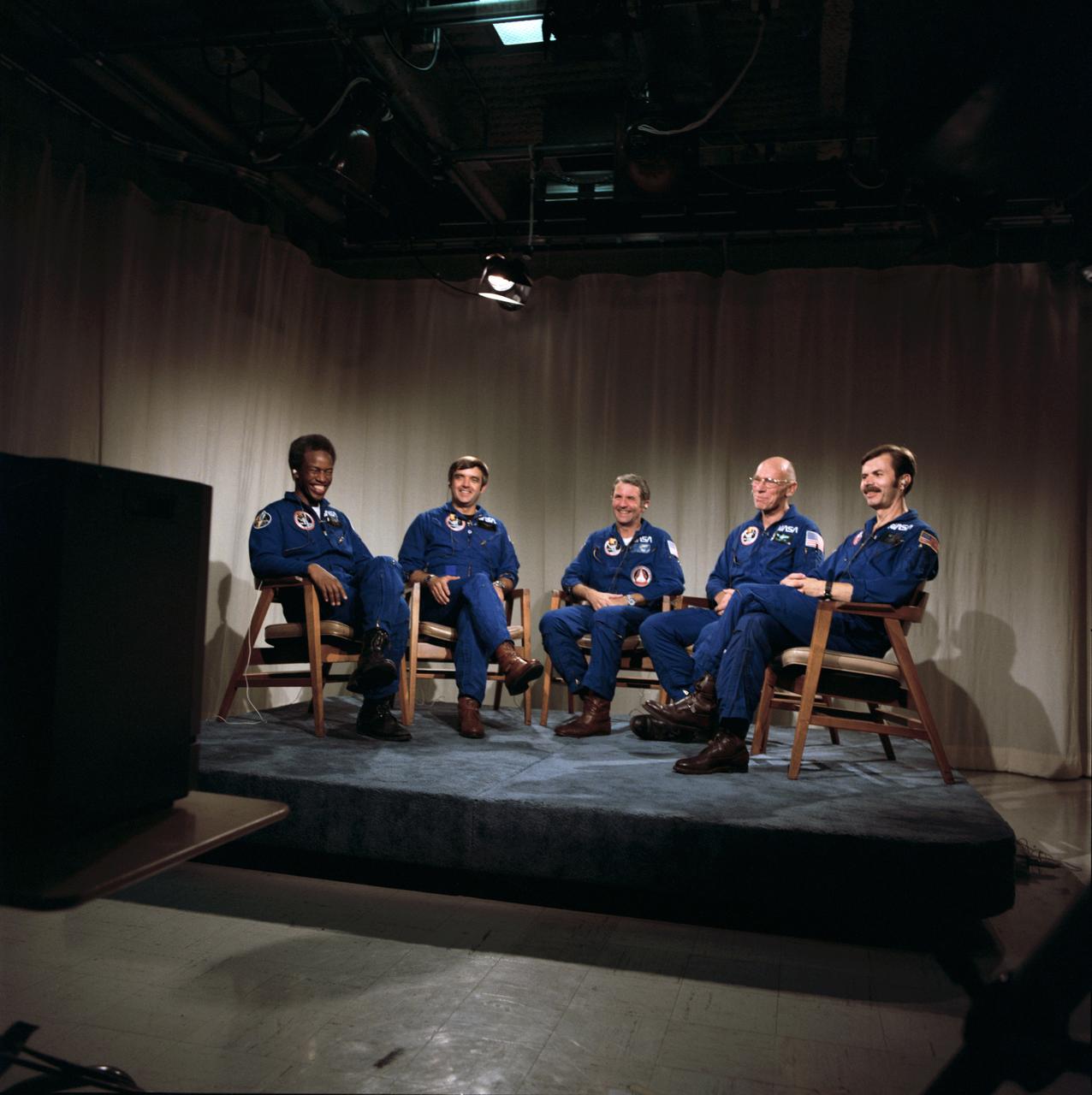S83-39693 (5 Sept 1983) ---  The five member astronaut crew of the Space Shuttle Challenger for STS-8 responds to a comment made by President Ronald Reagan during a post flight telephone conversation with the chief executive. The five astronauts earlier today landed the reusable spacecraft at Edwards Air Force Base in California and were flown to JSC via NASA aircraft.  Richard H. Truly, center, is crew commander.  Pilot for the six day flight was Daniel C. Brandenstein, second left. The mission specialist were Guion S. Bluford, left: Dr. William S. Thornton, second right, and Dale A. Gardner, right.
