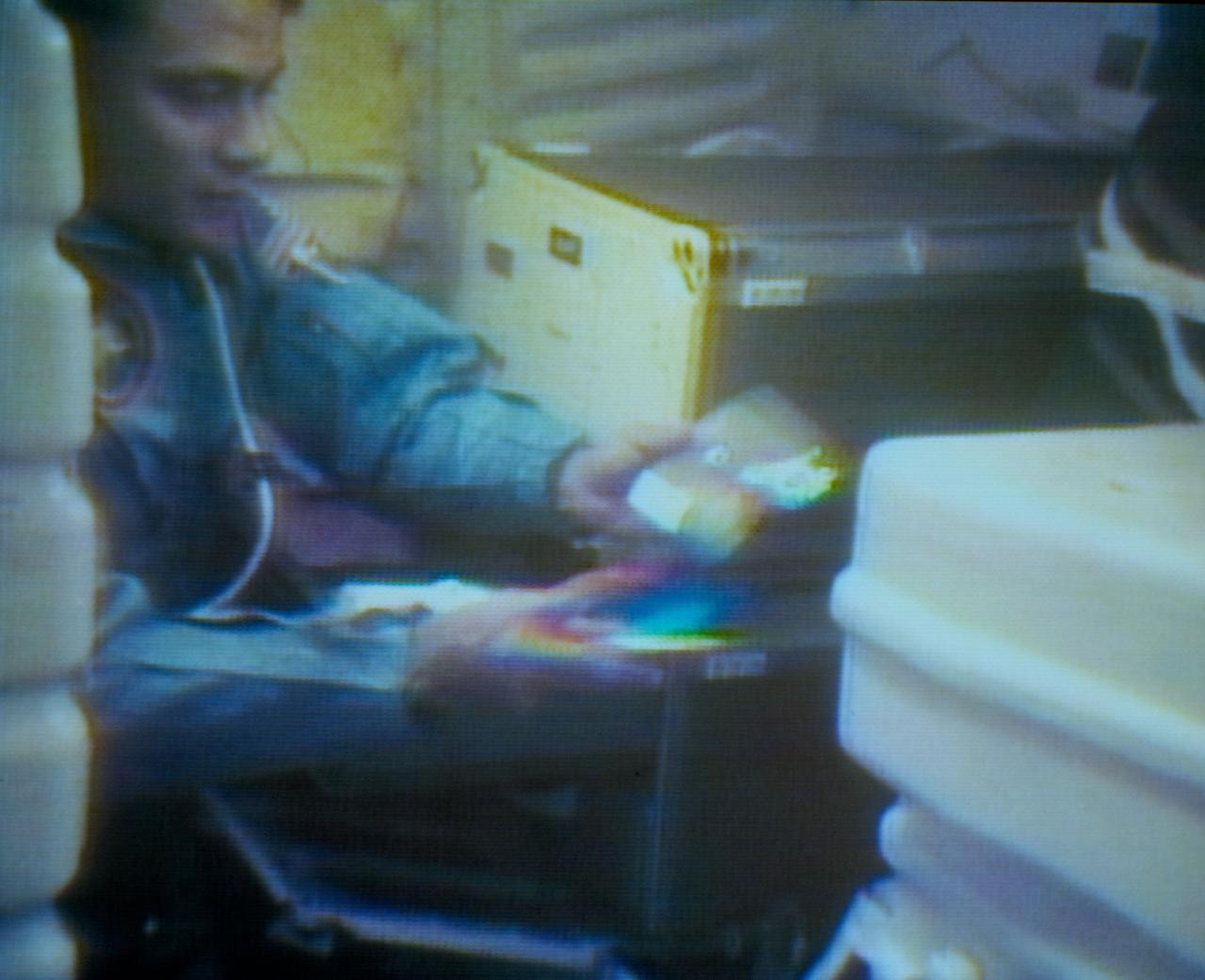 Press conference panel interviewing STS-8 onboard crew, 09/02/1983. Crew can be seen on TV screen.