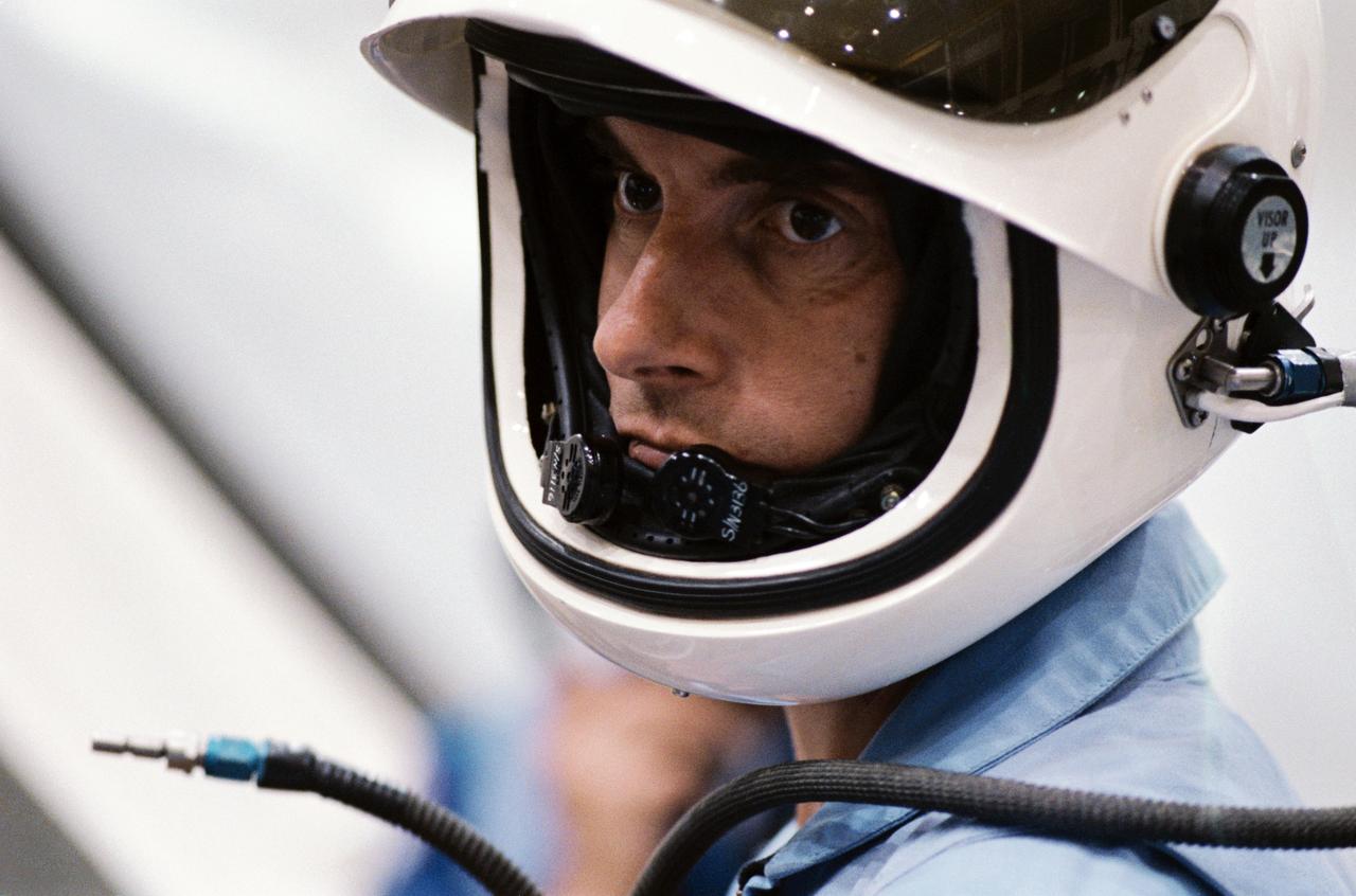 S83-41190 (9 September 1983) --- A close-up view of the serious countenance of West German Physicist Ulf Merbold was captured during a training session with all six STS-9 crewmembers in the Johnson Space Center’s (JSC) Shuttle Mockup and Integration Laboratory. Dr. Merbold is SL-1 payload specialist representing the European Space Agency (ESA). Dr. Merbold, from Max-Planck Institute in Stuttgart, is a specialist in crystal lattice defects and low-temperature physics. The photograph was taken by Otis Imboden.