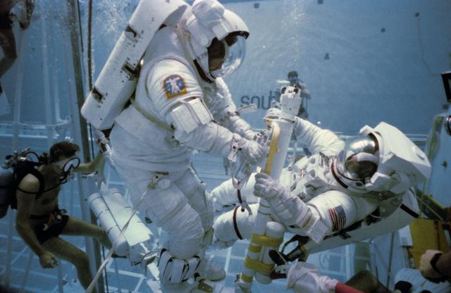 NASA image: Underwater EVA training in the WETF with astronauts Nelson and van Hoften