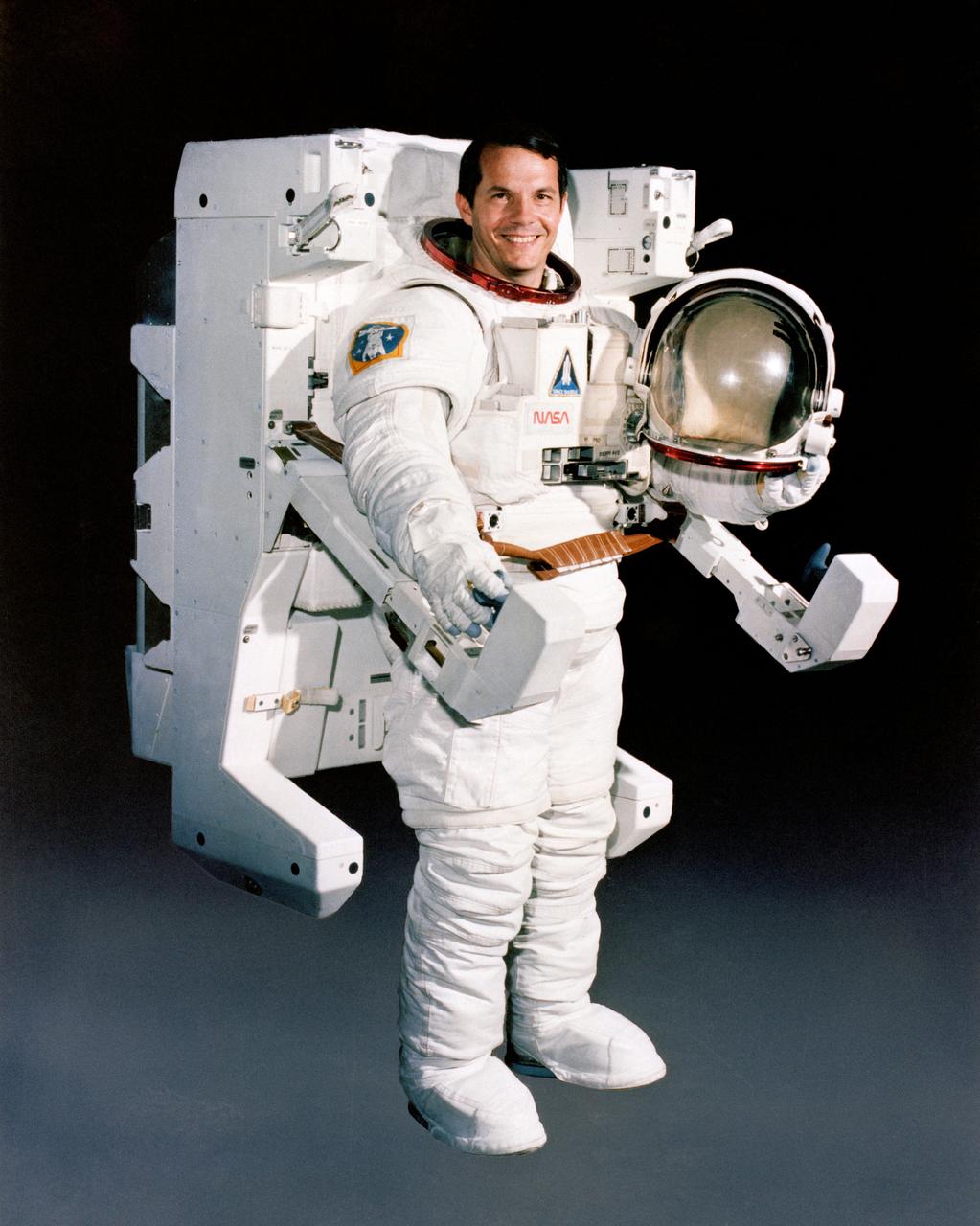 Portrait photographs of STS-11/41B Crewman Robert L. Stewart, wearing the Extravehicular Maneuvering Unit (EMU) with the Manned Manuevering Unit (MMU) attached, and without helmet.