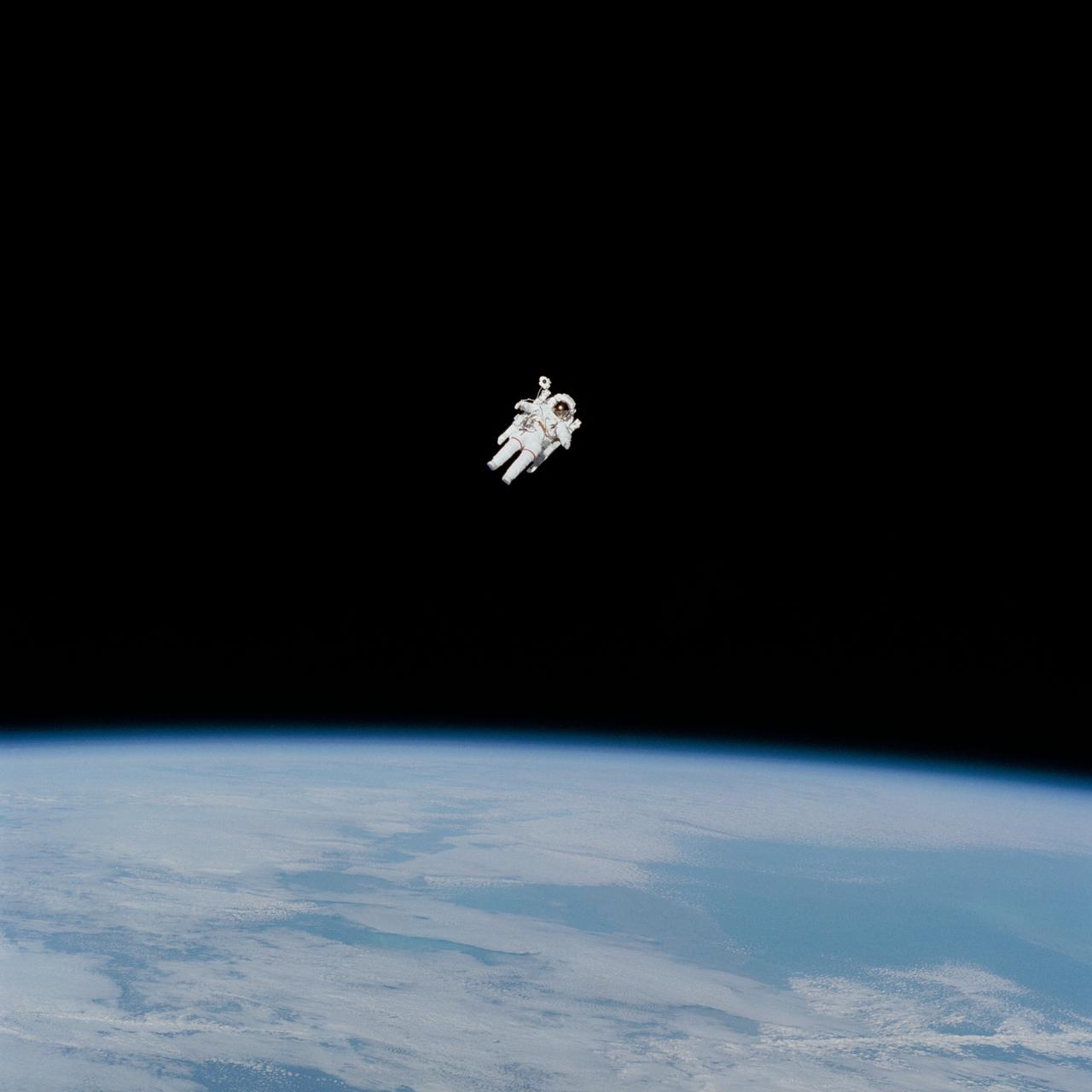 S84-27018 (7 Feb 1984) --- Astronaut Bruce McCandless II approaches his maximum distance from the Earth-orbiting Space Shuttle Challenger in this 70mm frame photographed by his fellow crewmembers onboard the reusable vehicle.  McCandless is in the midst of the first "field" tryout of the nitrogen-propelled, hand-controlled back-pack device called the manned maneuvering unit (MMU).  Astronaut Robert L. Stewart got a chance to test the same unit a while later in the lengthy EVA session while the two spacewalkers were photographed and monitored by their fellow crewmembers in Challenger's cabin.  Those inside were Astronauts Vance D. Brand, Robert L. Gibson and Dr. Ronald E. McNair.