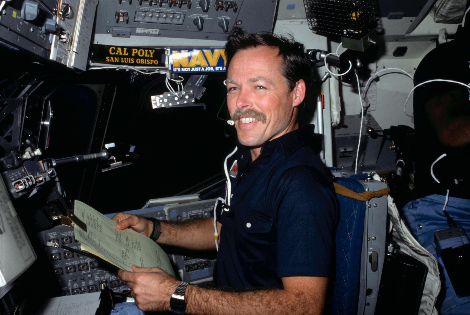 Astronaut Hoot Gibson on shuttle flight deck for STS-41B