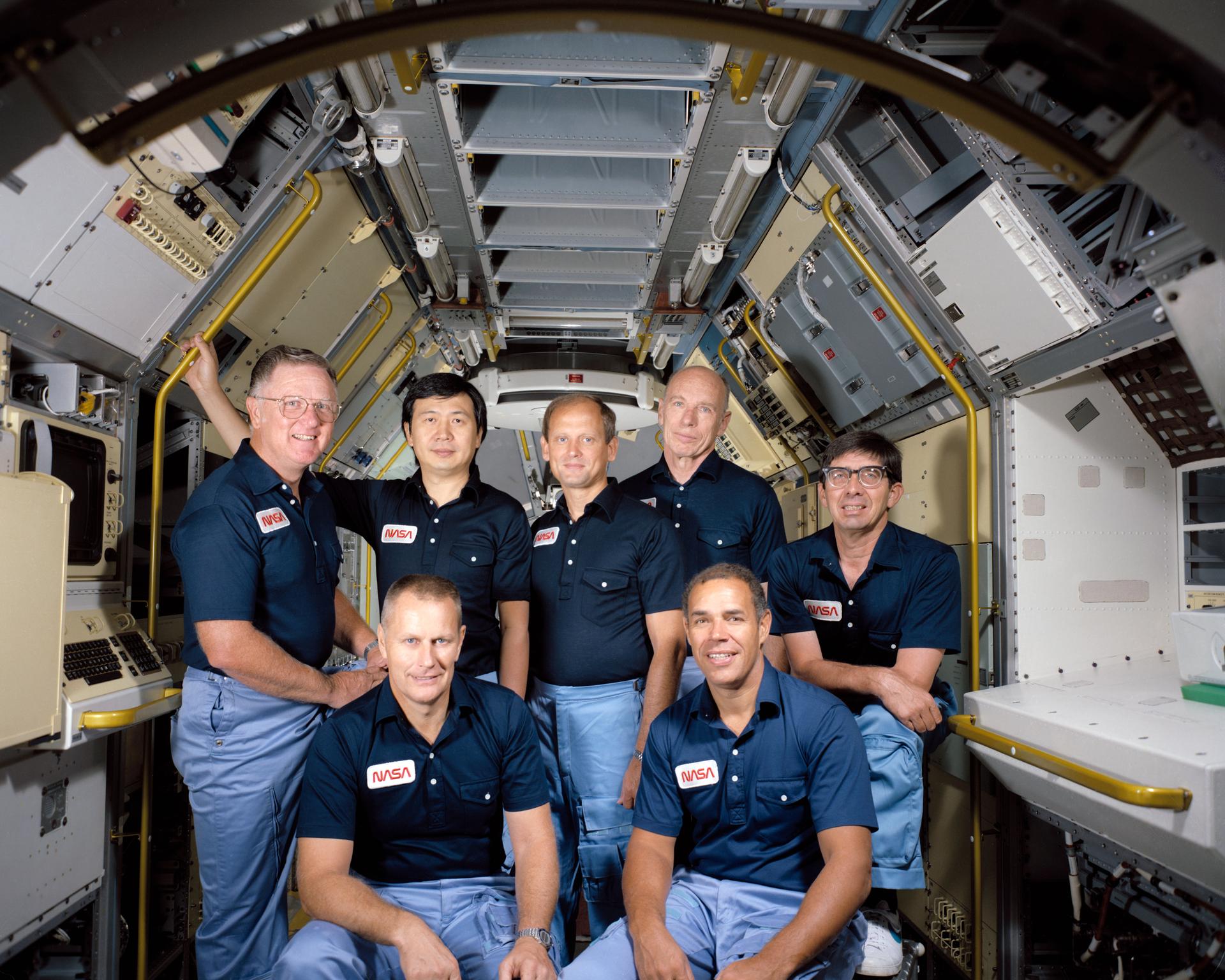 Crew portrait for STS-51B (Spacelab 3) with the 7 men who flew on the mission.