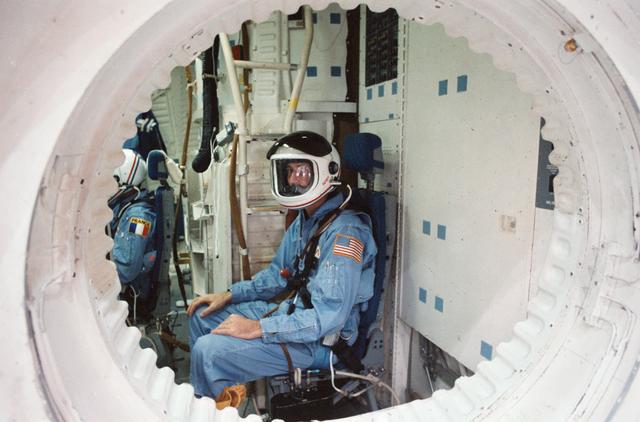 NASA image: STS 51-E crew is briefed on the Shuttle full fuselage trainer