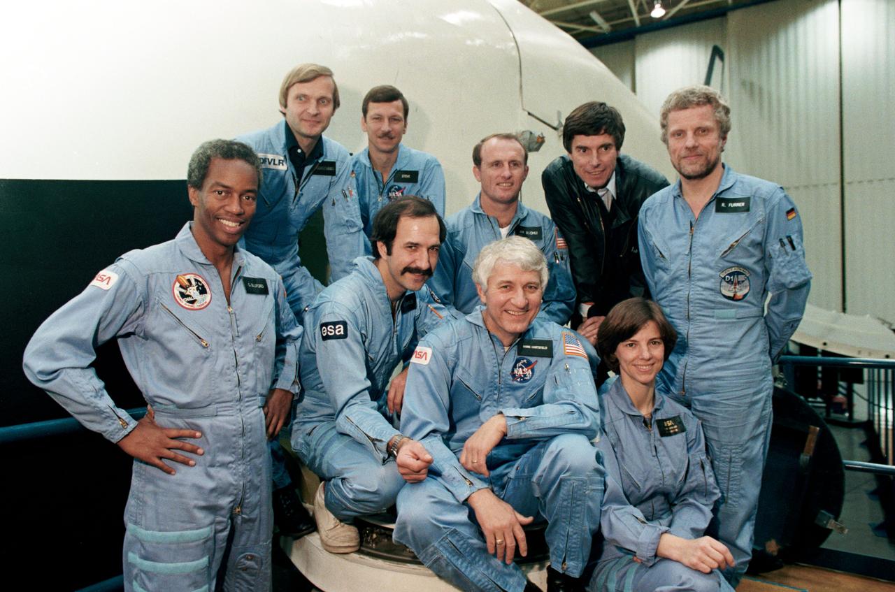 Unofficial group photo of the STS-61A Crew and Ulf Merbold, Bldg. 9A; and, 1-G Trainer Cockpit.          JSC, HOUSTON, TX            Also available in 4x5 BW