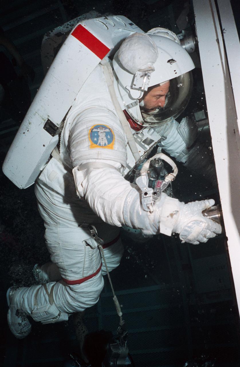 Astronauts Jeffrey Hoffman and David Griggs in Egress Training. 1. STS-51E - CREW TRAINING JSC, Houston, Texas