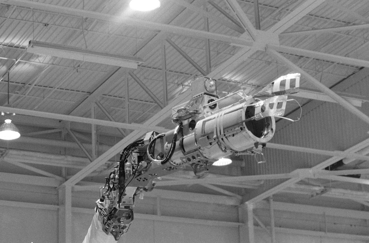 Simulation activities with the RMS in Bldg. 9A, with Astronaut Sally Ride testing the feasibility of the "Flyswatter" design for the STS-23/51D Mission on 04/15/16/1985.     1. STS-23/51D - Crew Training (Flyswatter)  2. Shuttle - Simulation (Flyswatter)    JSC, Houston, TX