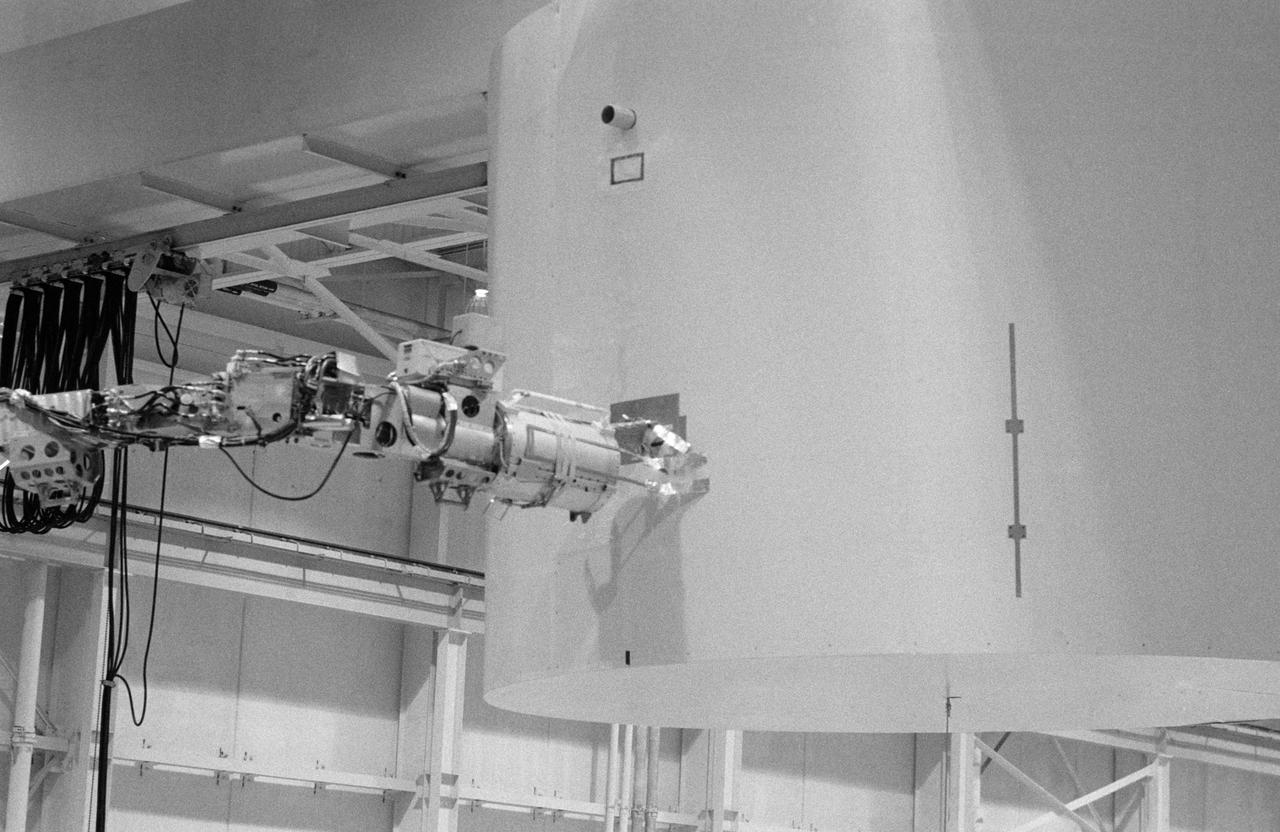 Simulation activities with the RMS in Bldg. 9A, with Astronaut Sally Ride testing the feasibility of the "Flyswatter" design for the STS-23/51D Mission on 04/15/16/1985.     1. STS-23/51D - Crew Training (Flyswatter)  2. Shuttle - Simulation (Flyswatter)    JSC, Houston, TX