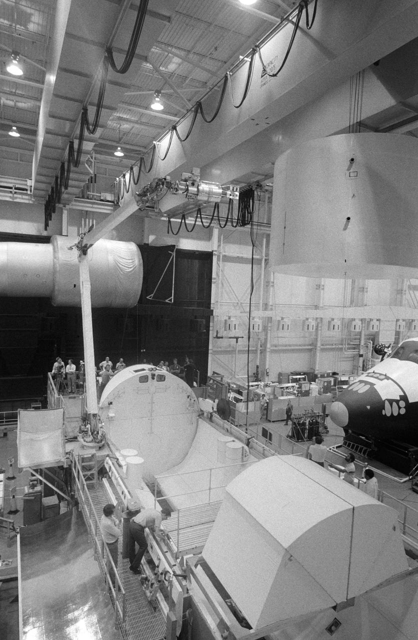 Simulation activities with the RMS in Bldg. 9A, with Astronaut Sally Ride testing the feasibility of the "Flyswatter" design for the STS-23/51D Mission on 04/15/16/1985.     1. STS-23/51D - Crew Training (Flyswatter)  2. Shuttle - Simulation (Flyswatter)    JSC, Houston, TX