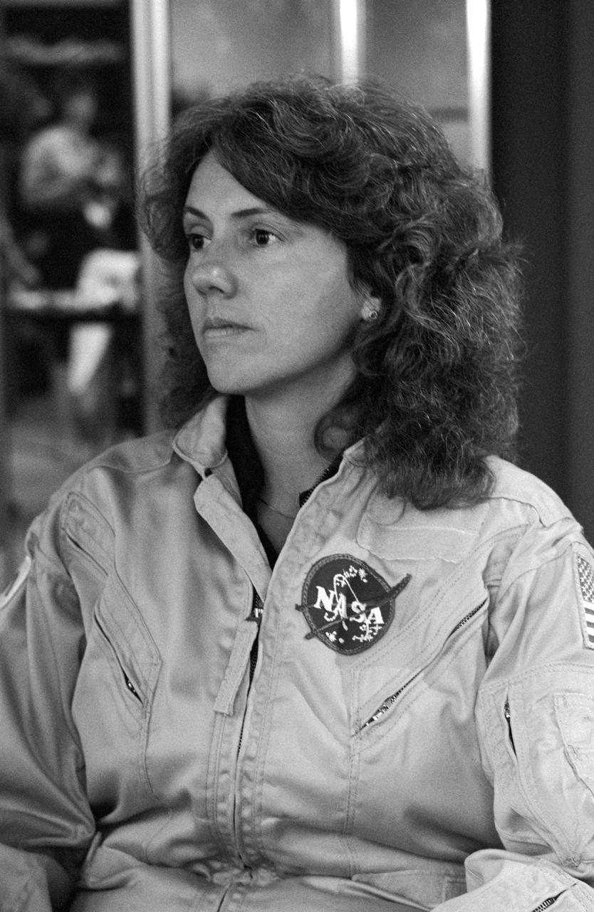S85-40075 (12 Sept. 1985) --- Teacher-in-Space participant Christa McAuliffe is pictured during her briefing on suit and personal hygiene equipment to be used on the STS-51L mission. Photo credit: NASA