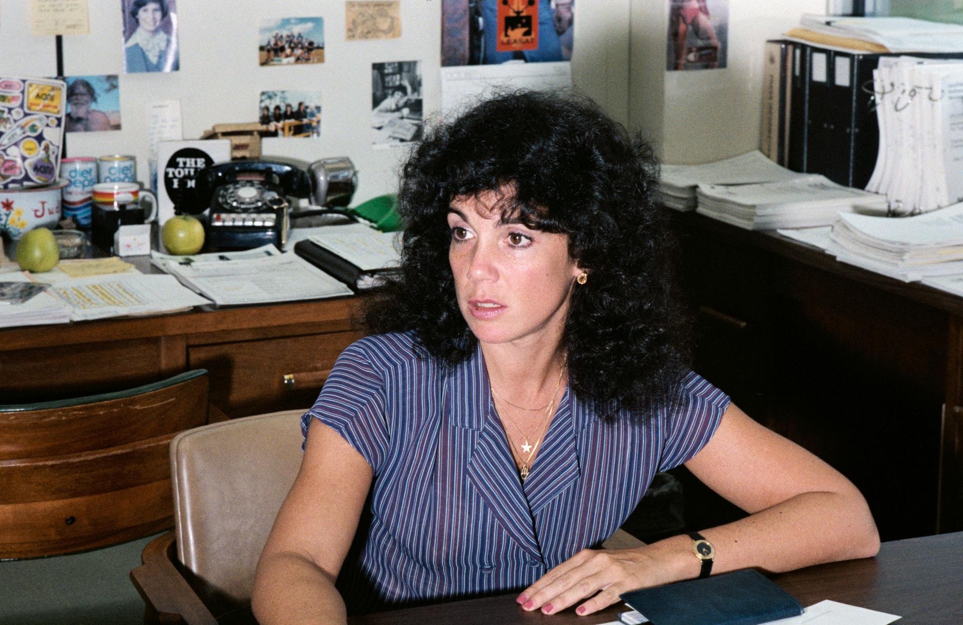 Judy Resnik sitting at a desk