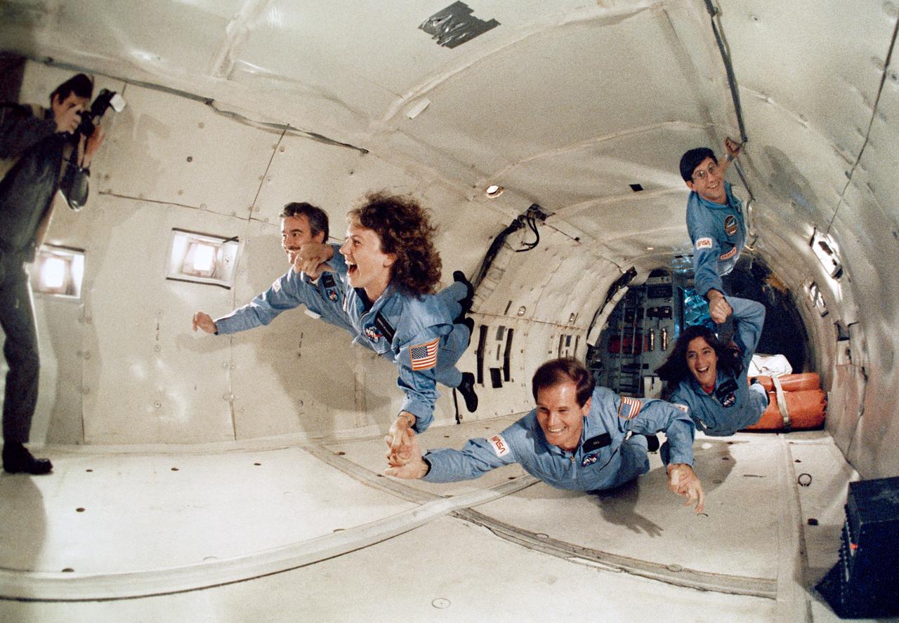 S85-44834 (20 Nov. 1985) --- This flying human chain represents prime and backup payload specialists for two upcoming STS missions. The group, representing trainees for STS-61C later this year and STS-51L early next year, shared some 40 parabolas in NASA?s KC-135, ?Zero-G? aircraft on Nov. 20, 1985. Left to right are Gerard Magilton, RCA backup payload specialist for STS-61C; Sharon Christa McAuliffe, payload specialist/teacher citizen observer for STS-51L; U.S. Representative Bill Nelson (D., Florida), scheduled for 61C; Barbara R. Morgan, backup to McAuliffe; and Robert J. Cenker, RCA payload specialist for 61C. The photo was taken by Otis Imboden. Photo credit: NASA