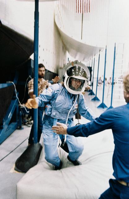 NASA image: Christa McAuliffe using Sky-genie during emergency egress training