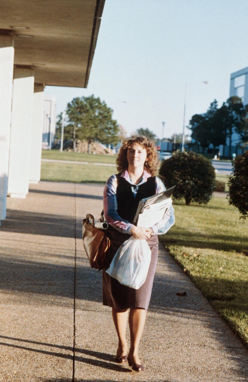 S86-25279 (November 1985) --- Sharon Christa McAuliffe, STS-51L payload specialist, has homework of her own to do as she prepares for a January 1986 flight. Photo by Keith Meyers of the New York Times. Photo credit: NASA