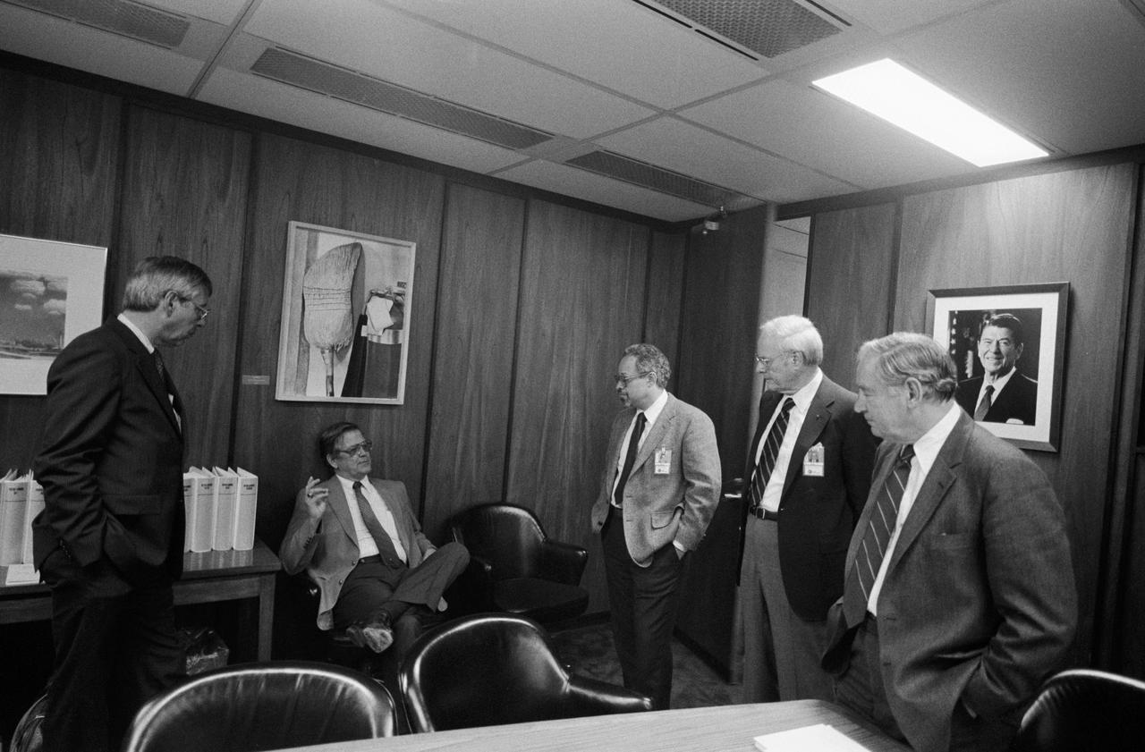 S86-28751 (5 March 1986) --- Two NASA officials talk with members of the Presidential Commission on the Space Shuttle Challenger Accident in the Executive Conference Room of JSC’s Project Management Building. Left to right are JSC Deputy Director Robert C. Goetz; Richard H. Kohrs, Deputy Manager, National Space Transportation Systems Office; and commission members Dr. Arthur B.C. Walker Jr., Robert W. Rummel and Joseph F. Sutter. Photo credit: NASA
