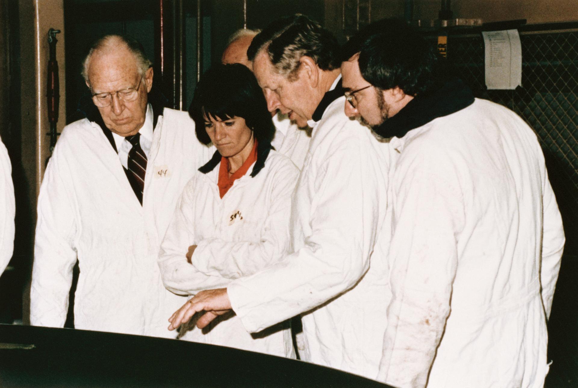 Richard Smith points out a portion of a solid rocket booster segment to astronaut Sally Ride and to the chairman of the Presidential Commission on the Space Shuttle Challenger Accident, William P. Rogers.