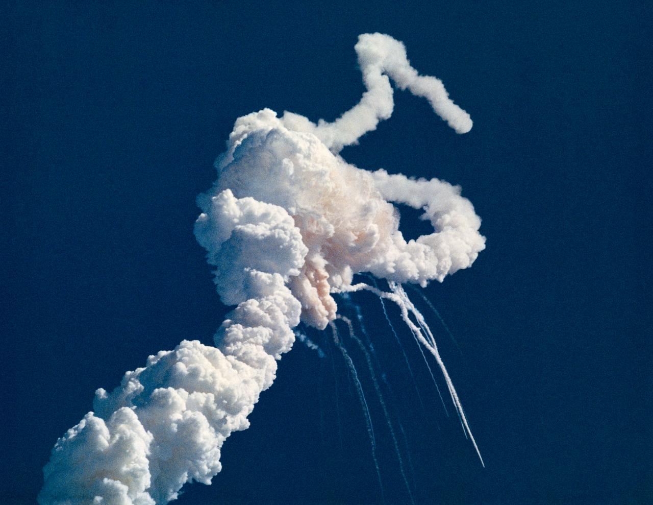 S86-38989 (28 Jan. 1986) --- Main engine exhaust, solid rocket booster plume and an expanding ball of gas from the external tank is visible seconds after the space shuttle Challenger accident on Jan. 28, 1986. (NOTE: The 51-L crew members lost their lives in the space shuttle Challenger accident moments after launch on Jan. 28, 1986 from the Kennedy Space Center.) Photo credit: NASA