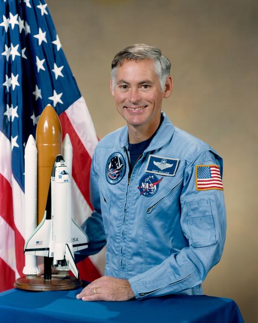 NASA image: PORTRAIT - ASTRONAUT MULLANE, RICHARD M. (BLUE FLIGHT SUIT) - JSC