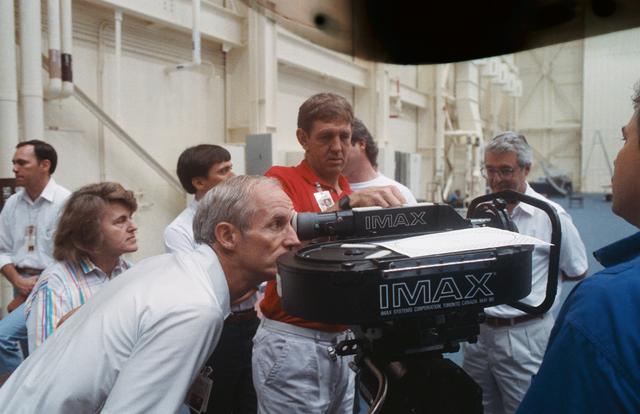 NASA image: STS-34 crewmembers train with the IMAX camera in JSC's Bldg 9B mockup area