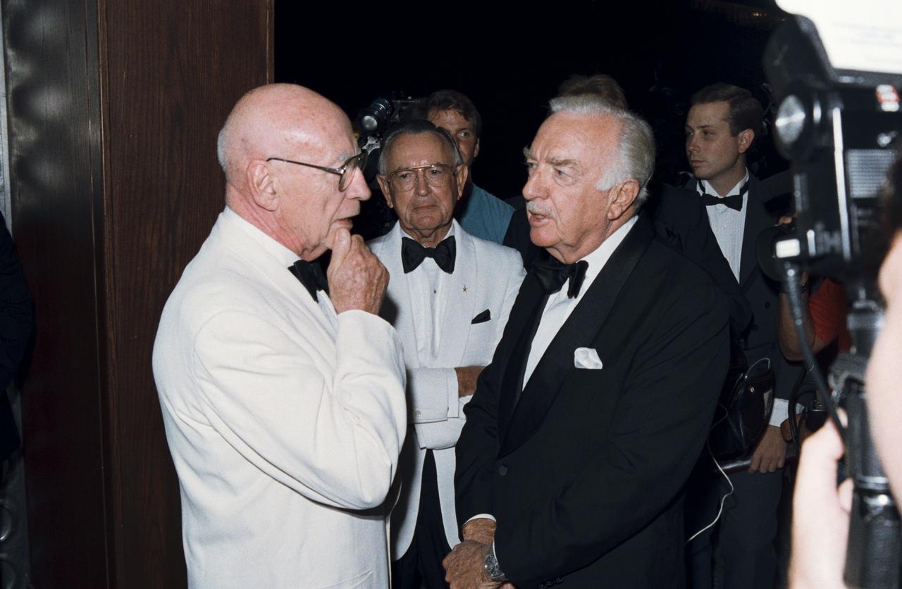 Views of the Apollo 11 Twentieth Anniversary Black Tie reception at the downtown Houston Hyatt Regency Hotel. Views include former JSC Directors Robert Gilruth and Christopher C. Kraft Jr. reminiscing with keynote speaker Walter Cronkite (39934); Apollo astronauts Tom Stafford (left) and Neil Armstrong (right) talk with former Soviet cosmonaut Alexei Leonov (center) at the gala (39935).