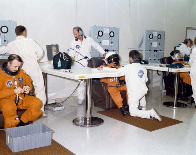 NASA image: KSC supplied views of the STS 28 crew suiting up, at  breakfast and