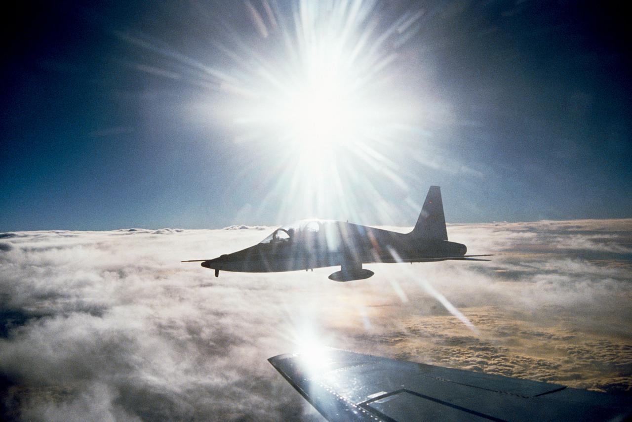 An airborne view of a T-38 taken from the Atlantis (STS-36) while landing at Edwards Air Force Base, California 03/04/90 by Mission Specialist Richard M. "Mike" Mullane.