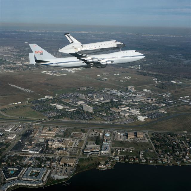 NASA image: Air-to-air view of Columbia, OV-102, atop SCA NASA 905 flying over JSC site