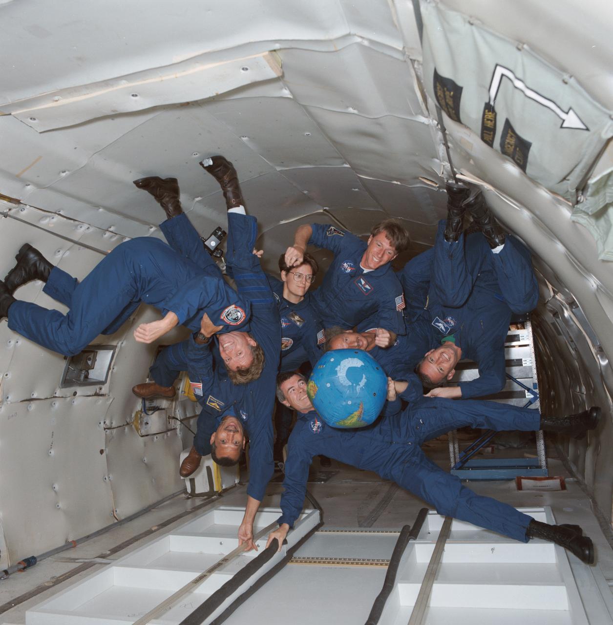 S91-44453 (21 Aug 1991) --- The crew of STS-45 is already training for its March 1992 mission, including stints on the KC-135 zero-gravity-simulating aircraft.  Shown with an inflatable globe are, clockwise from the top, C. Michael Foale, mission specialist; Dirk Frimout, payload specialist; Brian Duffy, pilot; Charles R. (Rick) Chappell, backup payload specialist; Charles F. Bolden, mission commander; Byron K. Lichtenberg, payload specialist; and Kathryn D. Sullivan, payload commander.