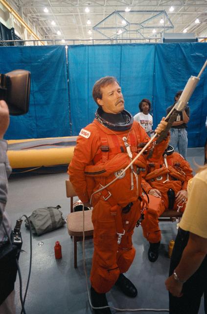 NASA image: STS-47 Commander Gibson holds sky genie equipment during JSC egress training