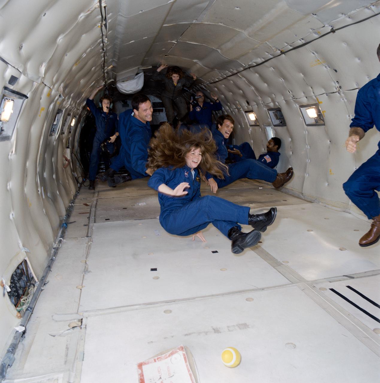 S94-26350 (10 Jan. 1994) --- Astronaut Catherine G. Coleman seems to enjoy the brief period of weightlessness she is sharing with fellow members of the 1992 class of astronauts. The weightless experience was afforded by a special parabolic pattern flown by NASA?s KC-135 ?zero gravity? aircraft. Left to right behind her are astronauts Michael E. Lopez-Alegria, Kevin R. Kregel and Winston E. Scott. EDITOR?S NOTE: Since this photograph was taken the four have been named to flights as follows: Kregel, STS-70; Scott, STS-72.