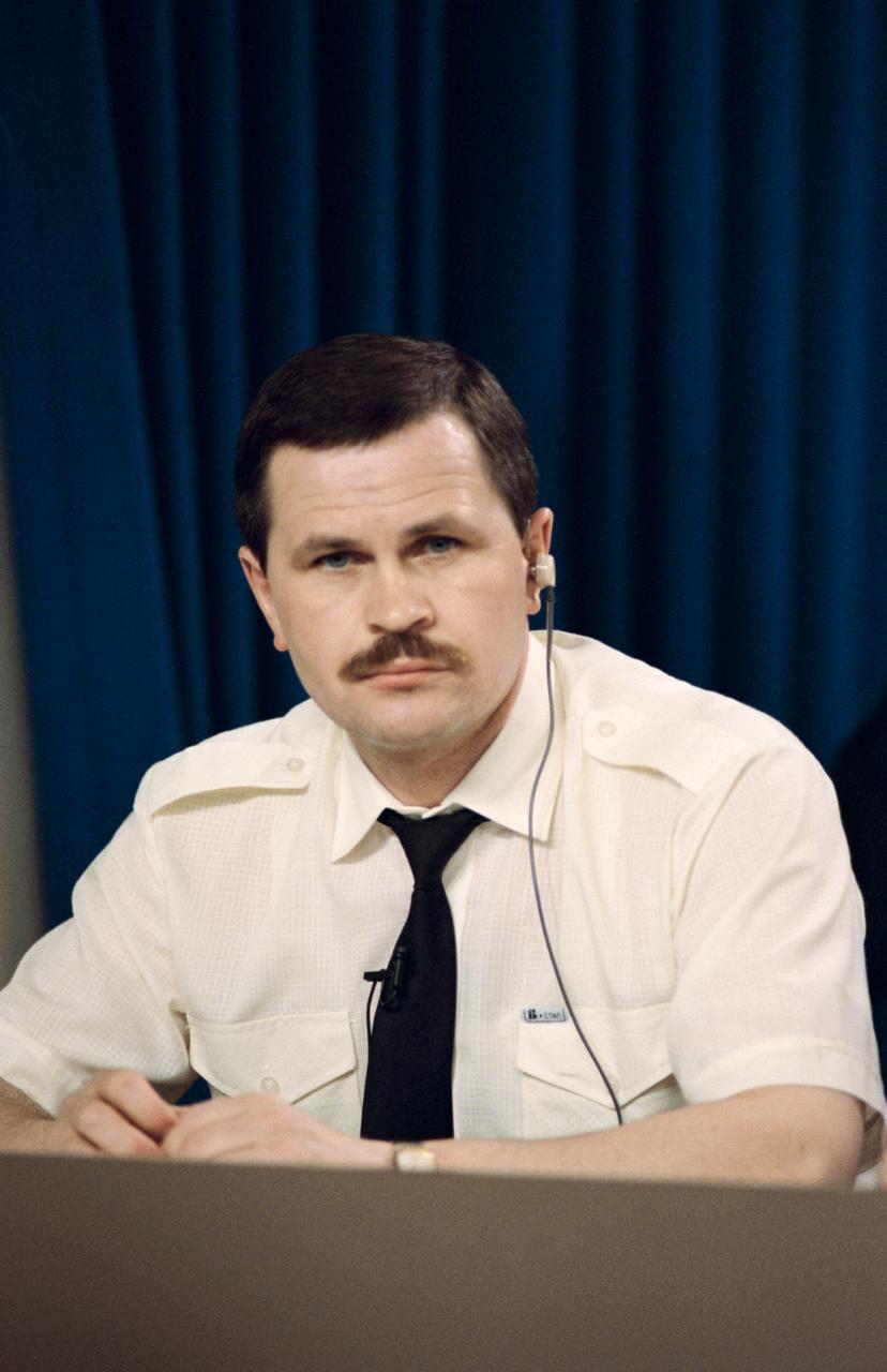 Cosmonaut Nikolai M. Budarin, flight engineer for Mir 19, ponders a question from a news media representative. Crew members for two of the joint Space Shuttle/Mir missions met the press at JSC.