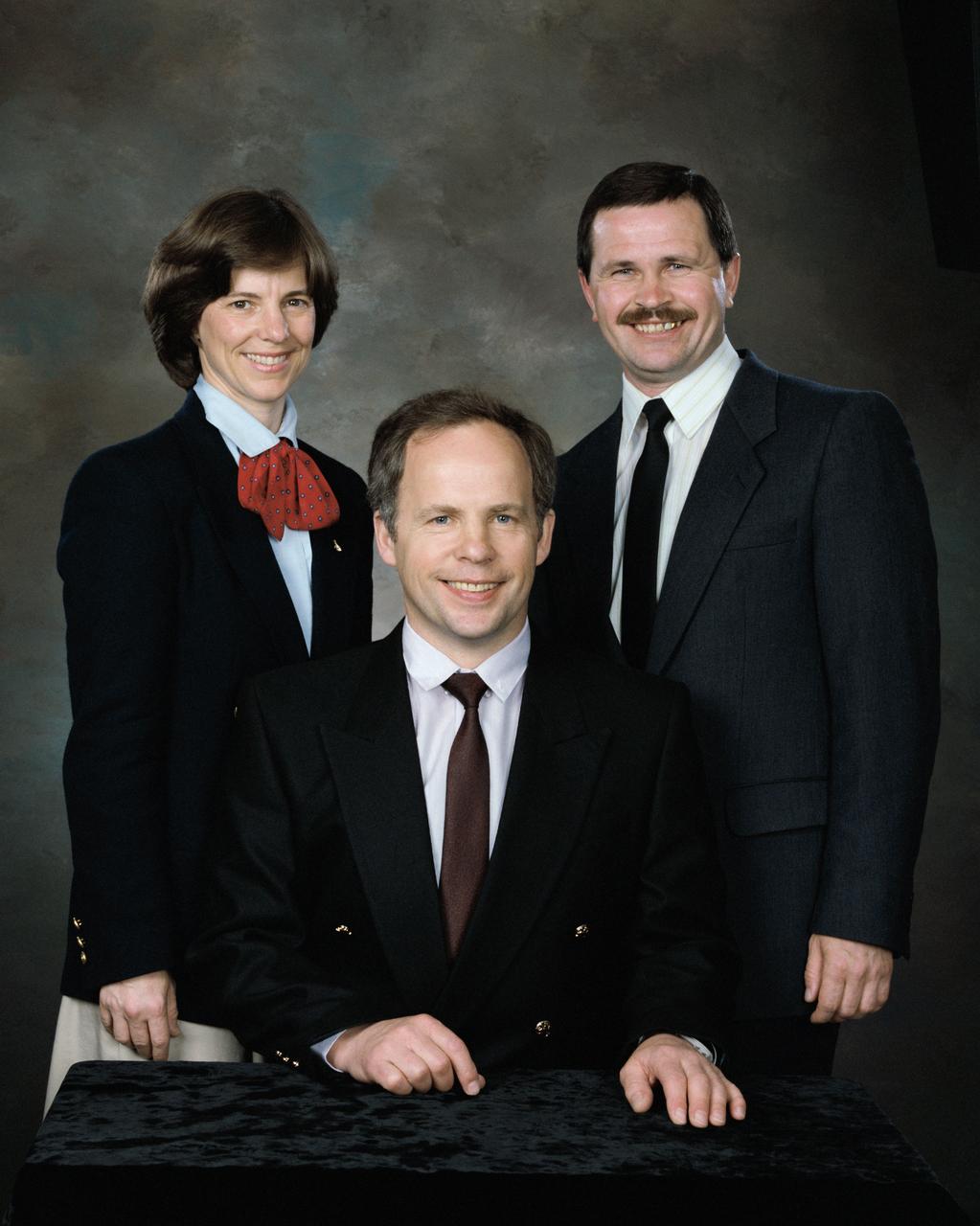 S94-34942 (27 May 1994) --- This is a portrait of (left to right) Bonnie J. Dunbar, Anatoliy Y. Solovyev, and Nikolai M. Budarin in civilian clothes.  Dunbar is mission specialist for STS-71, and alternate crew member for Mir 18.  Solovyev is commander for Mir 19, and Budarin is the flight engineer for that mission.