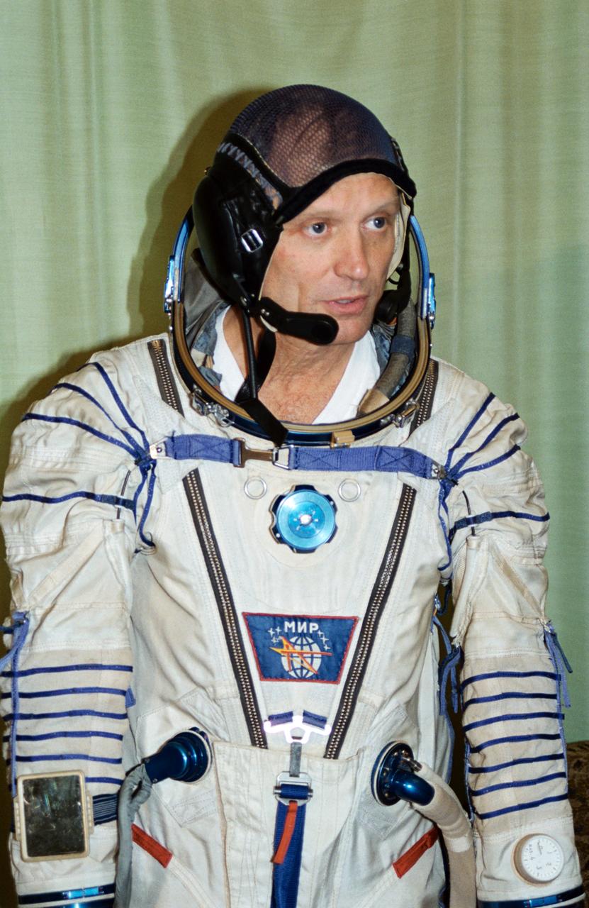 S94-45643 (20 Sept 1994) --- Astronaut Norman E. Thagard in a cosmonaut space suit in the Training Simulator Facility at the Gagarin Cosmonaut Training Center (Star City), near Moscow, Russia.  In March 1995, astronaut Thagard is scheduled to be launched in a Russian Soyuz spacecraft with two cosmonauts to begin a three-month tour of duty on the Russian Mir Space Station.  Thagard, along with his back-up, astronaut Bonnie J. Dunbar, has been training in Russia since February 1994.  During his stay on Mir, he will conduct a variety of life sciences experiments that will provide U.S. investigators with the first long-duration exposure data since Skylab in the late 1970's.  Thagard's mission will end in July when the Space Shuttle Atlantis, carrying the newly installed docking mechanism, docks with Mir Space Station for the first United States - Russian docking operation since Apollo-Soyuz in 1975.  The Orbiter will remain attached to Mir for five days of joint scientific operations before returning home with Thagard and his Russian crew mates and leaving behind two cosmonauts on Mir.