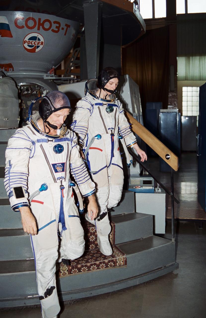 Astronauts Norman E. Thagard and Bonnie J. Dunbar in cosmonaut space suits in the Training Simulator Facility at the Gagarin Cosmonaut Training Center (Star City), near Moscow, Russia. In March 1995, astronaut Thagard is scheduled to be launched in a Russian Soyuz spacecraft with two cosmonauts to begin a three-month tour of duty on the Russian Mir Space Station. Thagard, along with his back-up, astronaut Bonnie J. Dunbar, has been training in Russian since February 1994.