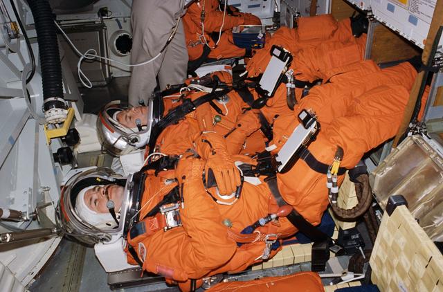 NASA image: Cosmonauts Solovyev and Budarin check out hardware to be flown on STS-71