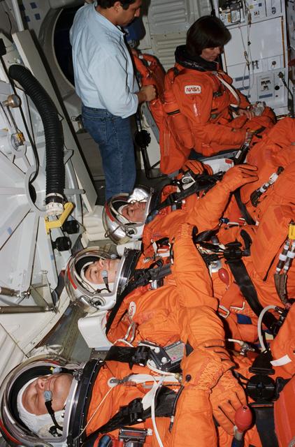 NASA image: STS-71 cosmonauts and astronauts examine hardware to be flown on mission
