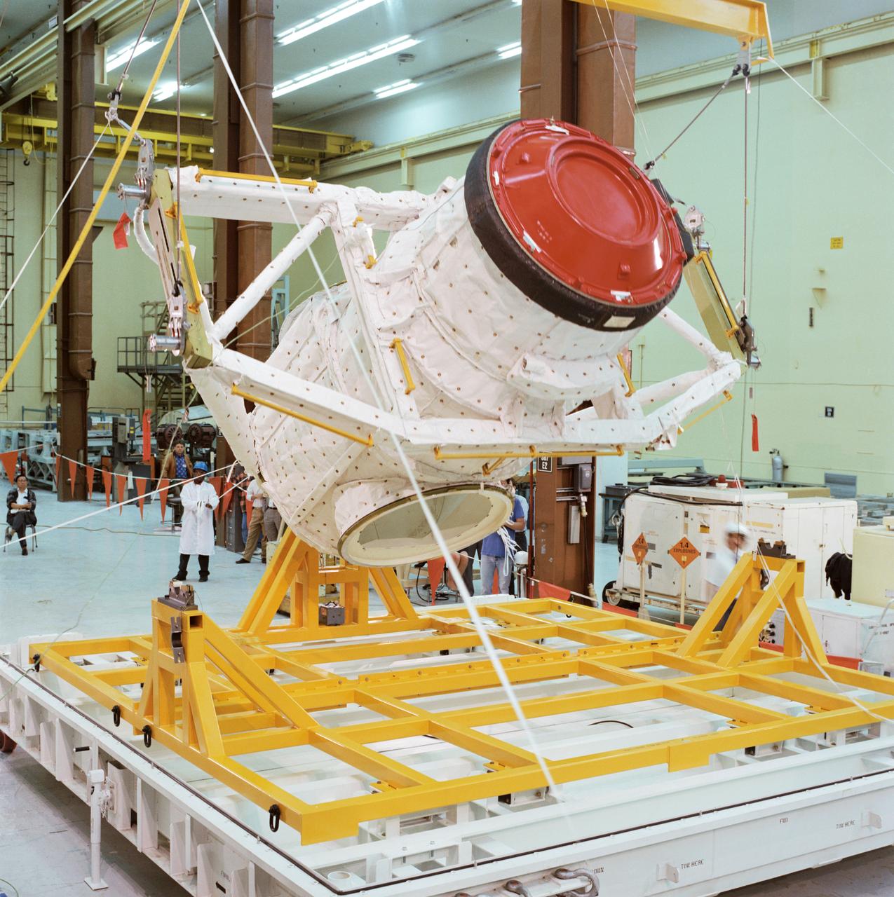 S95-00057 (15 Nov 1994) --- In Rockwell's Building 290 at Downey, California, the external airlock assembly/Mir docking system is rotated into position for crating up for shipment to the Kennedy Space Center (KSC) in Florida.  Jointly developed by Rockwell and RSC Energia, the external airlock assembly and Mir docking system will be mounted in the cargo bay of the Space Shuttle Atlantis to enable the shuttle to link up to Russia's Mir space station.  The docking system contains hooks and latches compatible with the system currently housed on the Mir's Krystall module, to which Atlantis will attach for the first time next spring.  STS-71 will carry two Russian cosmonauts, who will replace a three-man crew aboard Mir including Norman E. Thagard, a NASA astronaut.  The combined 10-person crew will conduct almost five days of joint life sciences investigations both aboard Mir and in the Space Shuttle Atlantis's Spacelab module.