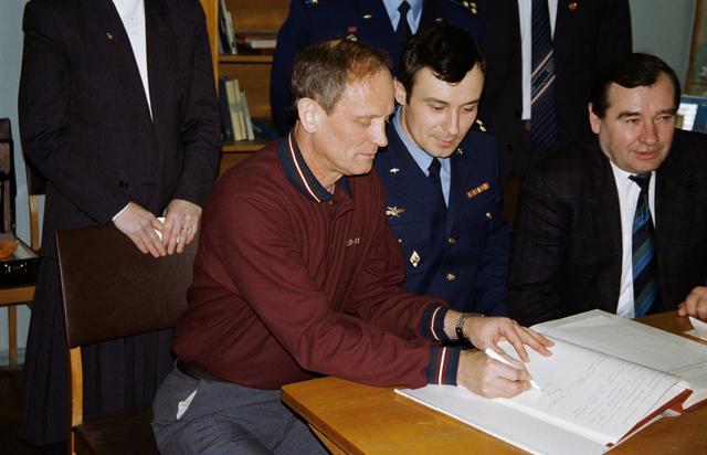 NASA image: Astronauts & cosmonauts sign Gagarin's diary