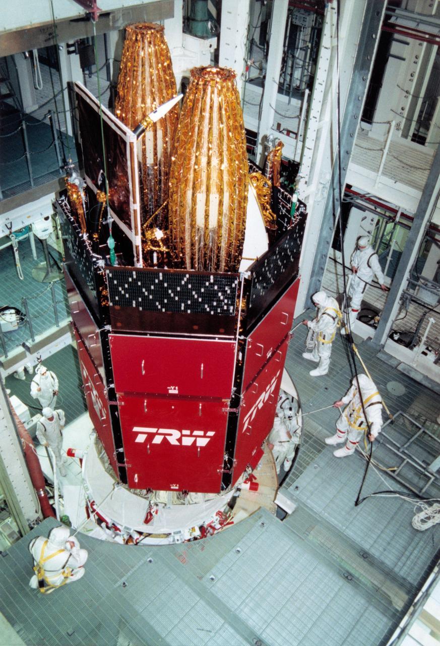 S95-08962 (12 APRIL 1995) --- Members of the Kennedy Space Center (KSC) Payload Processing Team hoist the Tracking and Data Relay Satellite (TDRS-G) into a work stand in the Vertical Processing Facility (VPF) for mating with its Inertial Upper Stage (IUS).  After testing and final checkout, TDRS-G and the IUS will be transported to Launch Pad 39B and installed into the Space Shuttle Discovery's payload bay for launch on the STS-70 mission, scheduled for launch June 8, 1995.