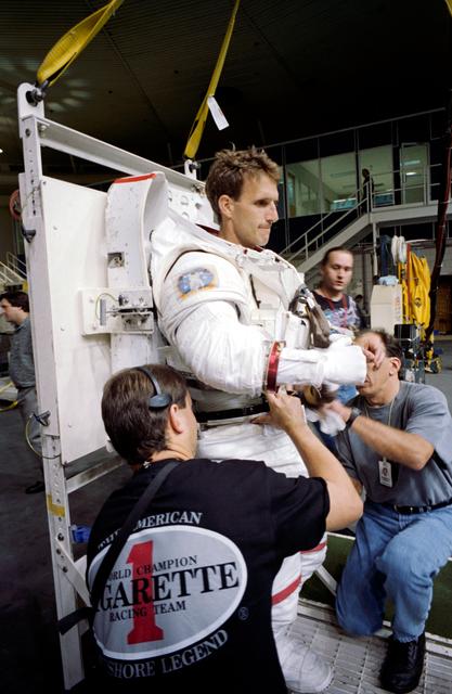 NASA image: Astronauts Michael Foale and Jerry Linenger training with Russian Orlan suit
