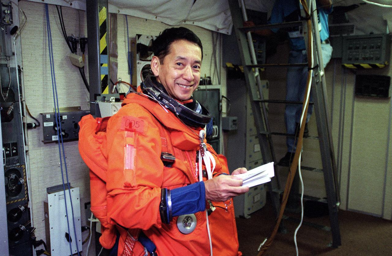 S99-10565 (24 August 1999) --- Astronaut   Mamoru Mohri, STS-99 mission specialist,  goes over a checklist on the mid deck of   a shuttle trainer at the Johnson Space Center (JSC).  Mohri represents Japan's  National Space Development Agency (NASDA).  He will be making his second flight in space and his second flight aboard the Space Shuttle Endeavour, having flown as a payload specialist on the STS-47 mission in 1992.